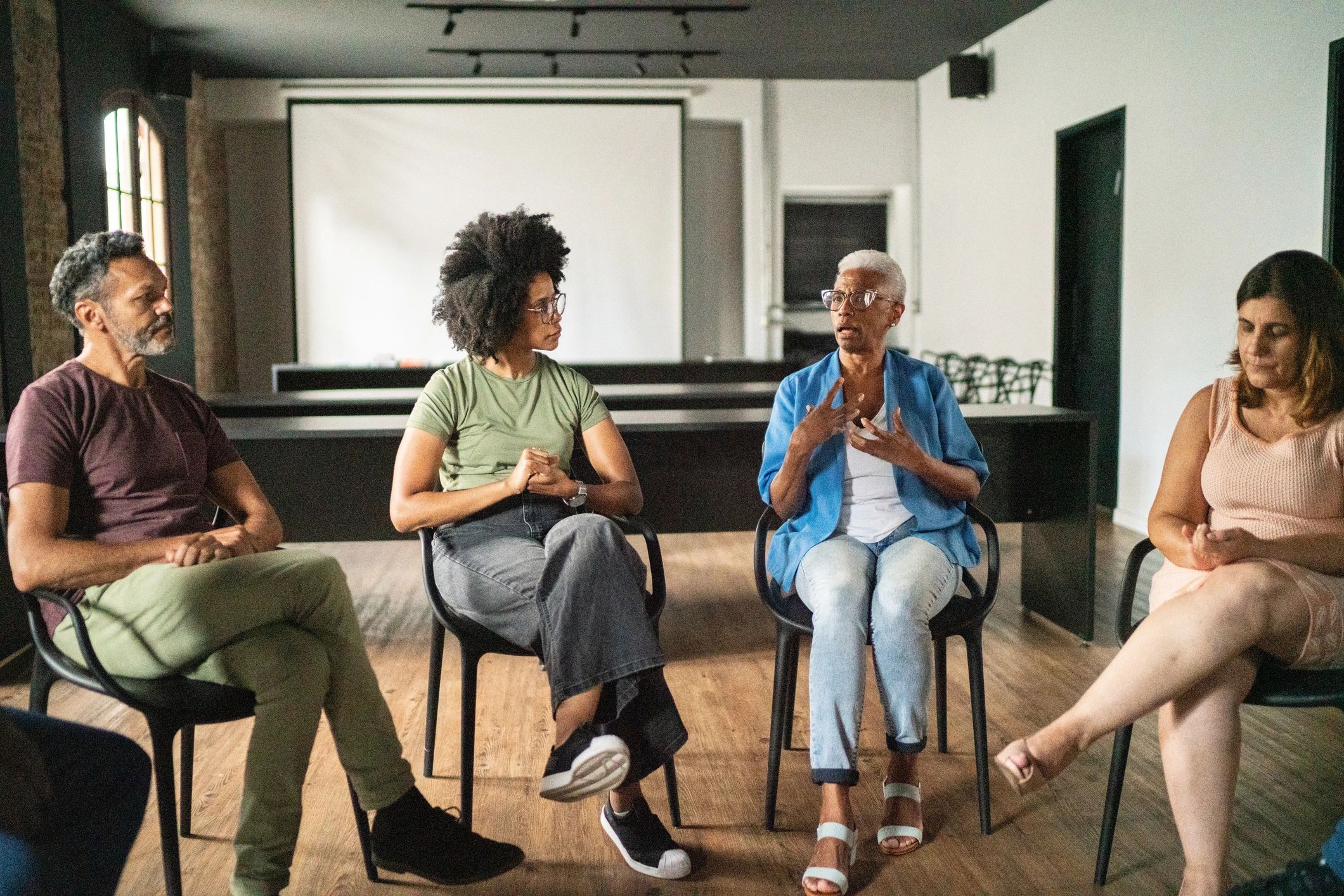 Adults taking part in a group discussion